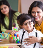 Happy teacher embracing preschool student Happy teacher embracing preschool student